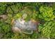 Expansive estate with meticulously landscaped grounds offers an enchanting, private retreat surrounded by lush greenery at 4183 Paran Pines Nw Dr, Atlanta, GA 30327