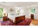 Main bedroom with a king bed, and windows offering a peaceful retreat bathed in natural light at 4183 Paran Pines Nw Dr, Atlanta, GA 30327