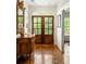 Elegant foyer featuring hardwood floors, a decorative mirror, and a glass paneled double front door at 4183 Paran Pines Nw Dr, Atlanta, GA 30327