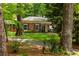 Inviting brick home with a well-maintained lawn and mature trees offering great curb appeal at 4183 Paran Pines Nw Dr, Atlanta, GA 30327