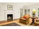 Cozy living room with fireplace, and bright natural light, perfect for relaxation and comfort at 4183 Paran Pines Nw Dr, Atlanta, GA 30327