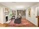 This living room offers a cozy fireplace, custom built-ins, and comfortable seating at 4183 Paran Pines Nw Dr, Atlanta, GA 30327