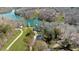 An aerial view of lakefront homes featuring private docks and beautiful landscaping at 6313 Shoreland Cir, Buford, GA 30518