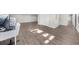 Open basement area with modern flooring, bright lighting, and gray walls at 6313 Shoreland Cir, Buford, GA 30518