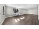 Finished basement showcasing modern flooring, neutral walls, and natural light at 6313 Shoreland Cir, Buford, GA 30518
