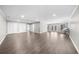 Bright basement features neutral walls, modern flooring, and access to a door at 6313 Shoreland Cir, Buford, GA 30518