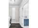 Laundry room with adjacent bathroom featuring a blue vanity and fixtures at 6313 Shoreland Cir, Buford, GA 30518
