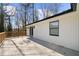 Spacious wood deck with a white modern house at 6313 Shoreland Cir, Buford, GA 30518