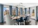 Dining room with water views, modern lighting, and ample seating at 6313 Shoreland Cir, Buford, GA 30518