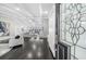 Elegant entryway with high ceilings and a view into the spacious living room at 6313 Shoreland Cir, Buford, GA 30518