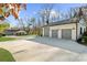Spacious home boasts a large three-car garage and an expansive driveway at 6313 Shoreland Cir, Buford, GA 30518