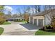 A well maintained home and detached three-car garage with a generous drive at 6313 Shoreland Cir, Buford, GA 30518