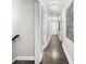 Hallway features hardwood floors and ample lighting, creating an inviting transition space at 6313 Shoreland Cir, Buford, GA 30518