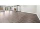 Spacious living room with stone fireplace, modern flooring, and gray paint at 6313 Shoreland Cir, Buford, GA 30518