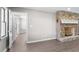 Living room showcasing a stone fireplace, gray paint, and modern flooring at 6313 Shoreland Cir, Buford, GA 30518
