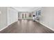 Living room features a gray wall color, modern flooring, and access to a door at 6313 Shoreland Cir, Buford, GA 30518