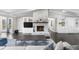 Open living room with a stone fireplace flanked by custom built-ins at 6313 Shoreland Cir, Buford, GA 30518