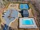 Aerial view of community amenities including pool, tennis courts, parking, and clubhouse in wooded area at 1436 Maston Rd, Auburn, GA 30011