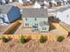 Aerial view of a fenced backyard featuring a well-maintained lawn and patio with outdoor seating at 1436 Maston Rd, Auburn, GA 30011