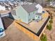 Aerial view of a fenced backyard with a patio, outdoor seating, and a well-maintained lawn at 1436 Maston Rd, Auburn, GA 30011