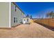 Spacious backyard featuring green siding, a wooden fence, and a cozy patio area, perfect for outdoor relaxation at 1436 Maston Rd, Auburn, GA 30011