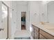 Well-lit bathroom featuring double sinks and a separate toilet and shower room at 1436 Maston Rd, Auburn, GA 30011