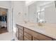 Well-lit bathroom featuring double sinks and a separate toilet and shower room at 1436 Maston Rd, Auburn, GA 30011
