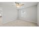 Bright bedroom with plush carpet, a ceiling fan, and a sunlit window for a relaxing atmosphere at 1436 Maston Rd, Auburn, GA 30011