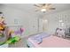 bedroom with plush carpet, ceiling fan, and a decorative vanity at 1436 Maston Rd, Auburn, GA 30011