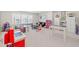 Spacious bonus room filled with natural light, perfect for a playroom or Gathering area at 1436 Maston Rd, Auburn, GA 30011