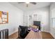 Bright home office with hardwood flooring, ceiling fan, and ample space for productivity at 1436 Maston Rd, Auburn, GA 30011