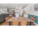 Open floor plan boasts a kitchen featuring white cabinets, barstool seating, and view into the dining and living room at 1436 Maston Rd, Auburn, GA 30011