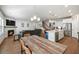 Spacious kitchen featuring white cabinets, stainless steel appliances, barstool seating, and open layout at 1436 Maston Rd, Auburn, GA 30011