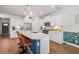 Bright kitchen with quartz countertops, stainless steel appliances, and seating at the large center island at 1436 Maston Rd, Auburn, GA 30011