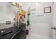 Well-organized laundry room with a modern washer-dryer and ample storage shelves for convenience at 1436 Maston Rd, Auburn, GA 30011