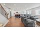 Open-concept living room flowing into a modern kitchen with an island and bar seating at 1436 Maston Rd, Auburn, GA 30011