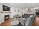 Comfortable living room featuring a fireplace, area rug, seating and view of the staircase and front door at 1436 Maston Rd, Auburn, GA 30011