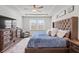 Large main bedroom with tray ceiling, lots of light, and TV at 1436 Maston Rd, Auburn, GA 30011