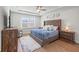 Main bedroom offers tray ceiling, soft natural light and TV at 1436 Maston Rd, Auburn, GA 30011