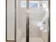 Luxurious tile shower featuring bench and adjustable shower head at 1436 Maston Rd, Auburn, GA 30011