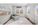 Sunroom with neutral decor, lots of natural light, and comfortable seating at 1436 Maston Rd, Auburn, GA 30011