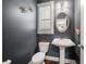 Charming powder room with pedestal sink, decorative mirror, and shuttered window at 144 Still Pine Bnd, Smyrna, GA 30082