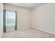 Bedroom with neutral walls, plush carpet and a large window offering natural light at 2623 Bloom Cir, Tucker, GA 30084