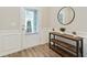 Stylish entryway featuring wood-look floors, console table, and decorative accents at 2623 Bloom Cir, Tucker, GA 30084