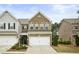 Charming brick two-story home featuring an attached two-car garage and well-maintained landscaping at 2623 Bloom Cir, Tucker, GA 30084