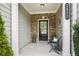 Inviting front porch with brick accents, space for seating, and a welcoming entrance at 2623 Bloom Cir, Tucker, GA 30084