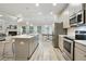 Open concept kitchen and living area with stainless appliances and modern finishes at 2623 Bloom Cir, Tucker, GA 30084