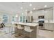 Modern kitchen featuring a large island, stainless steel appliances, and beautiful pendant lighting at 2623 Bloom Cir, Tucker, GA 30084