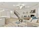 Bright living room featuring a staircase, fireplace, and modern decor at 2623 Bloom Cir, Tucker, GA 30084
