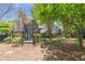 Backyard view with a multi-level terrace, screened in porch and lush landscaping at 356 Ivy Glen Cir, Avondale Estates, GA 30002